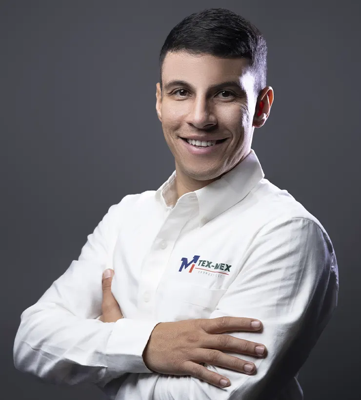 Image of Renato Mendoza, sales representative, smiling with confidence and crossed arms.